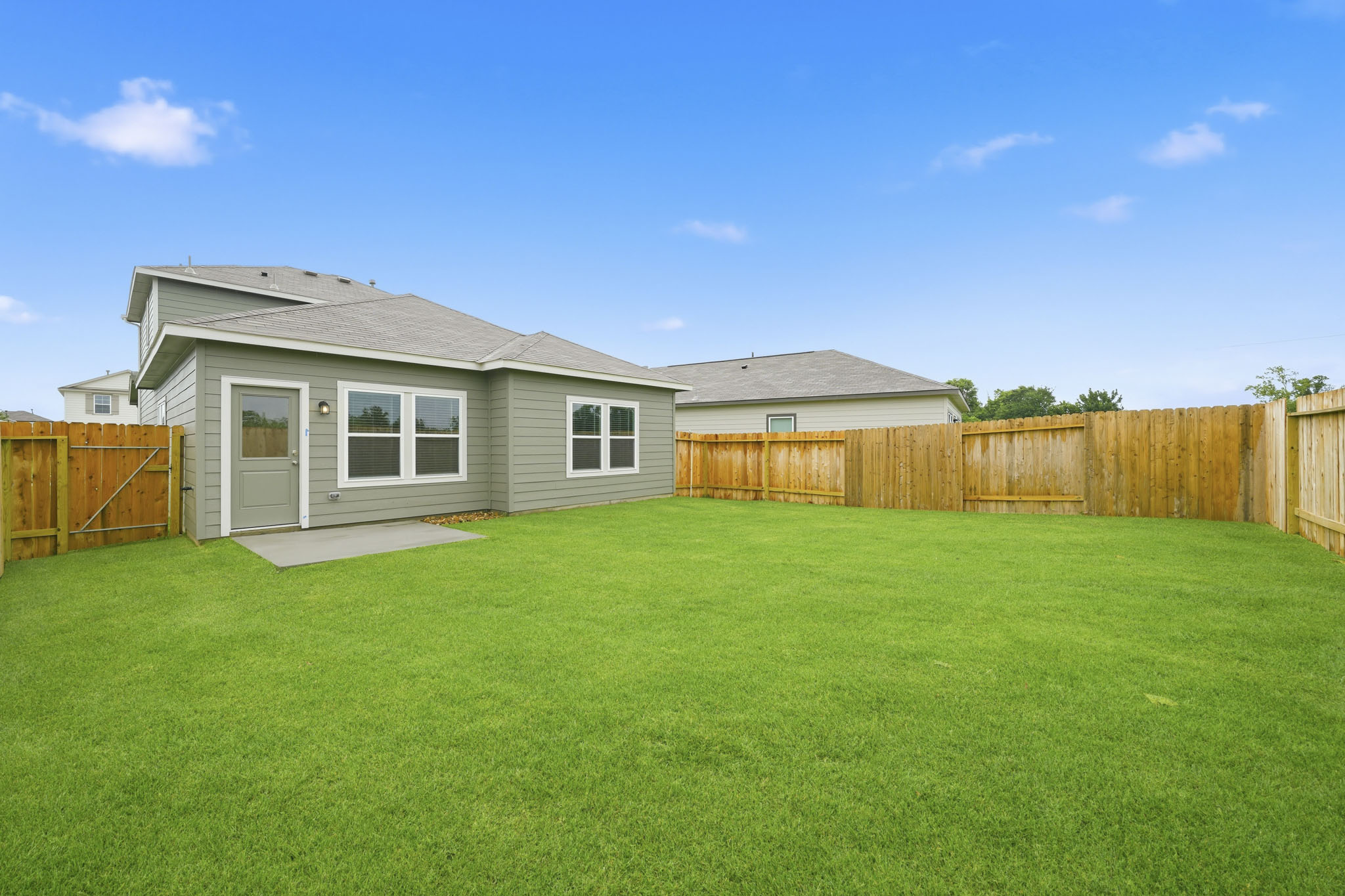 A house with a fence around it.