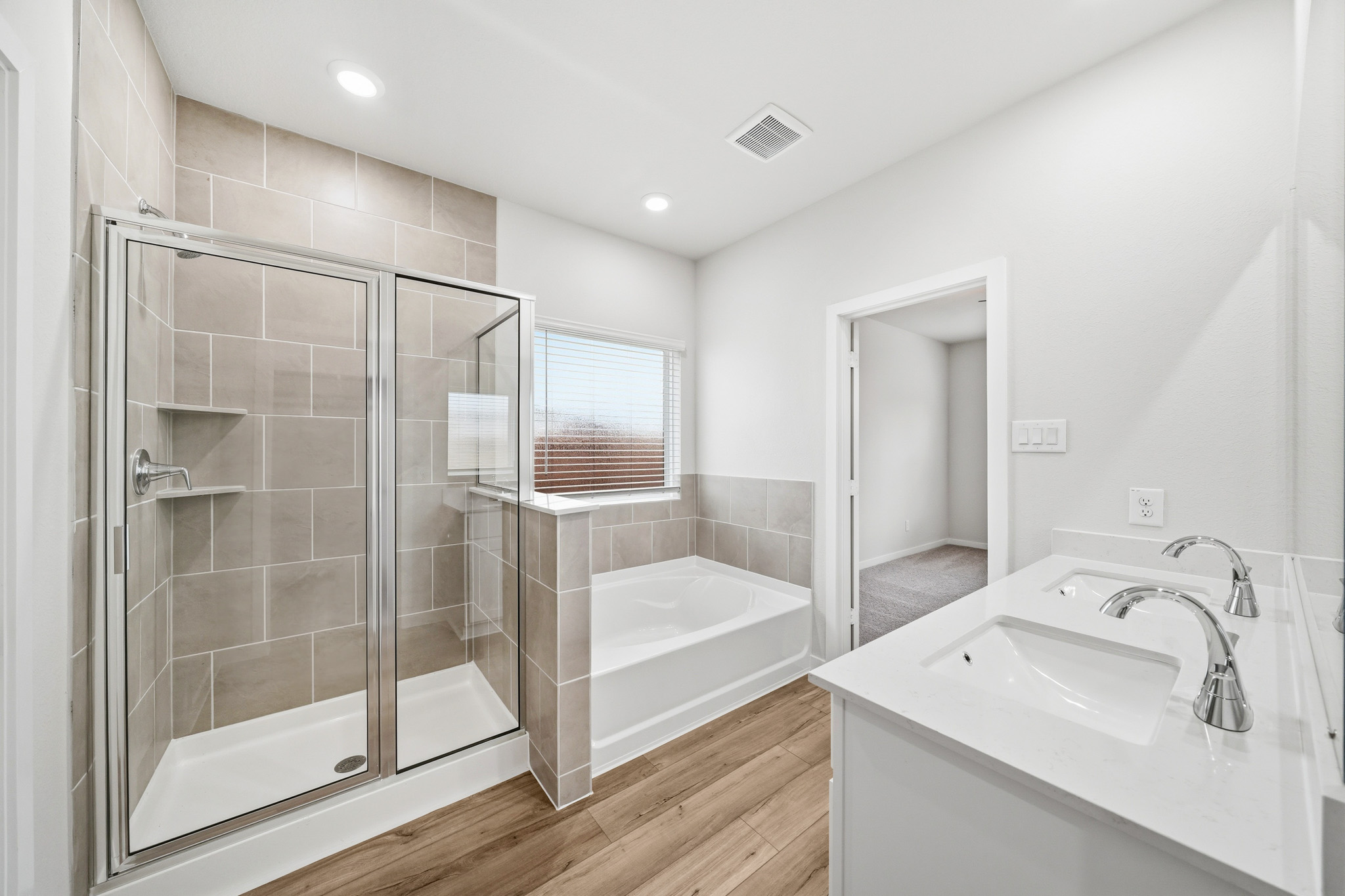 A bathroom with a glass shower.