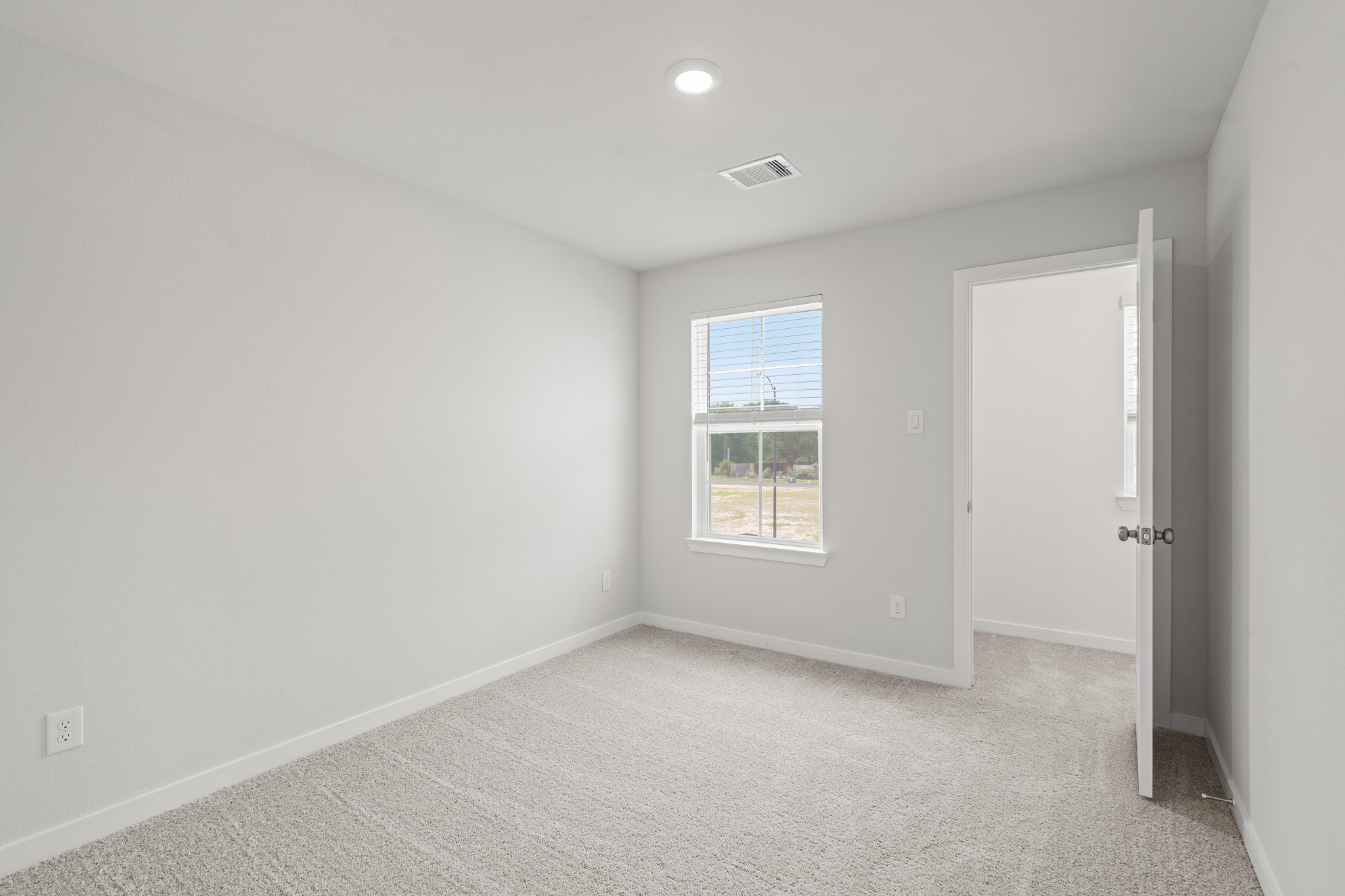 A room with a door and a window.