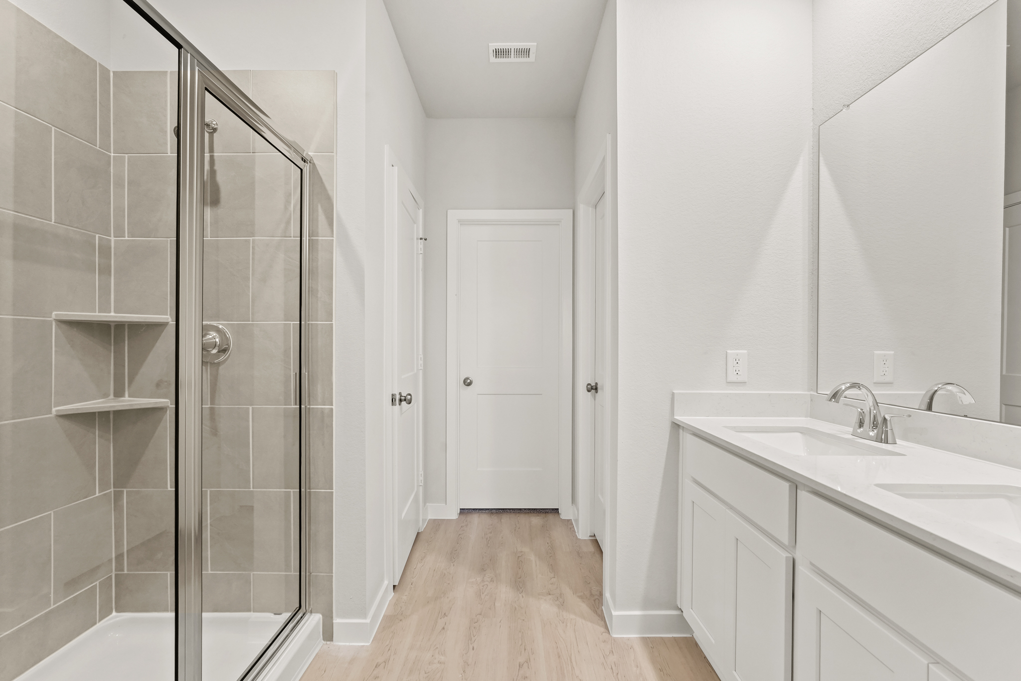 A bathroom with a glass shower.