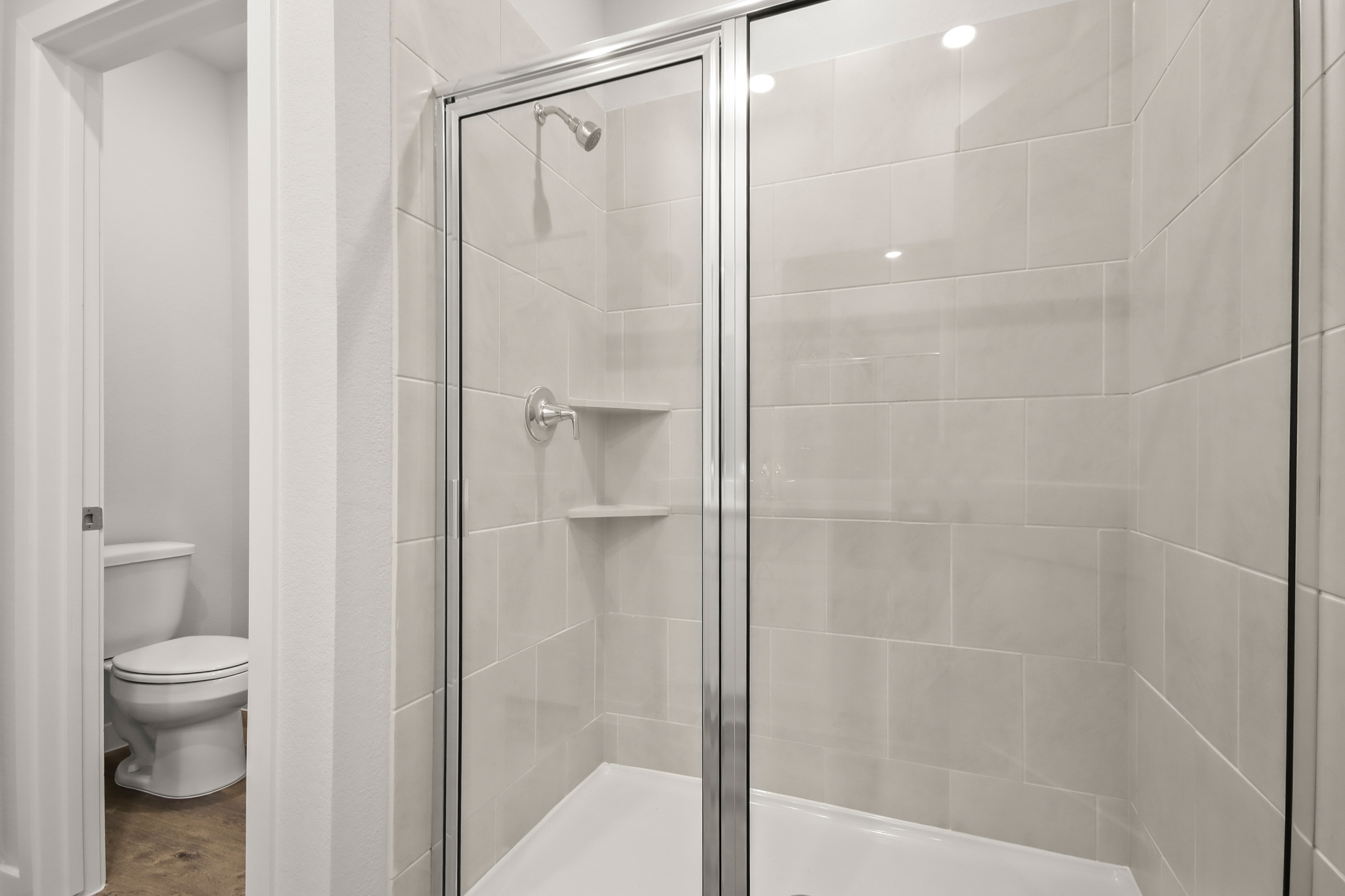 A bathroom with a glass shower.