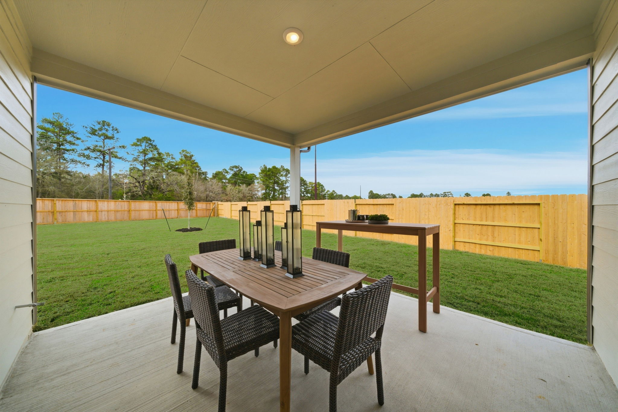 A table and chairs on a deck.