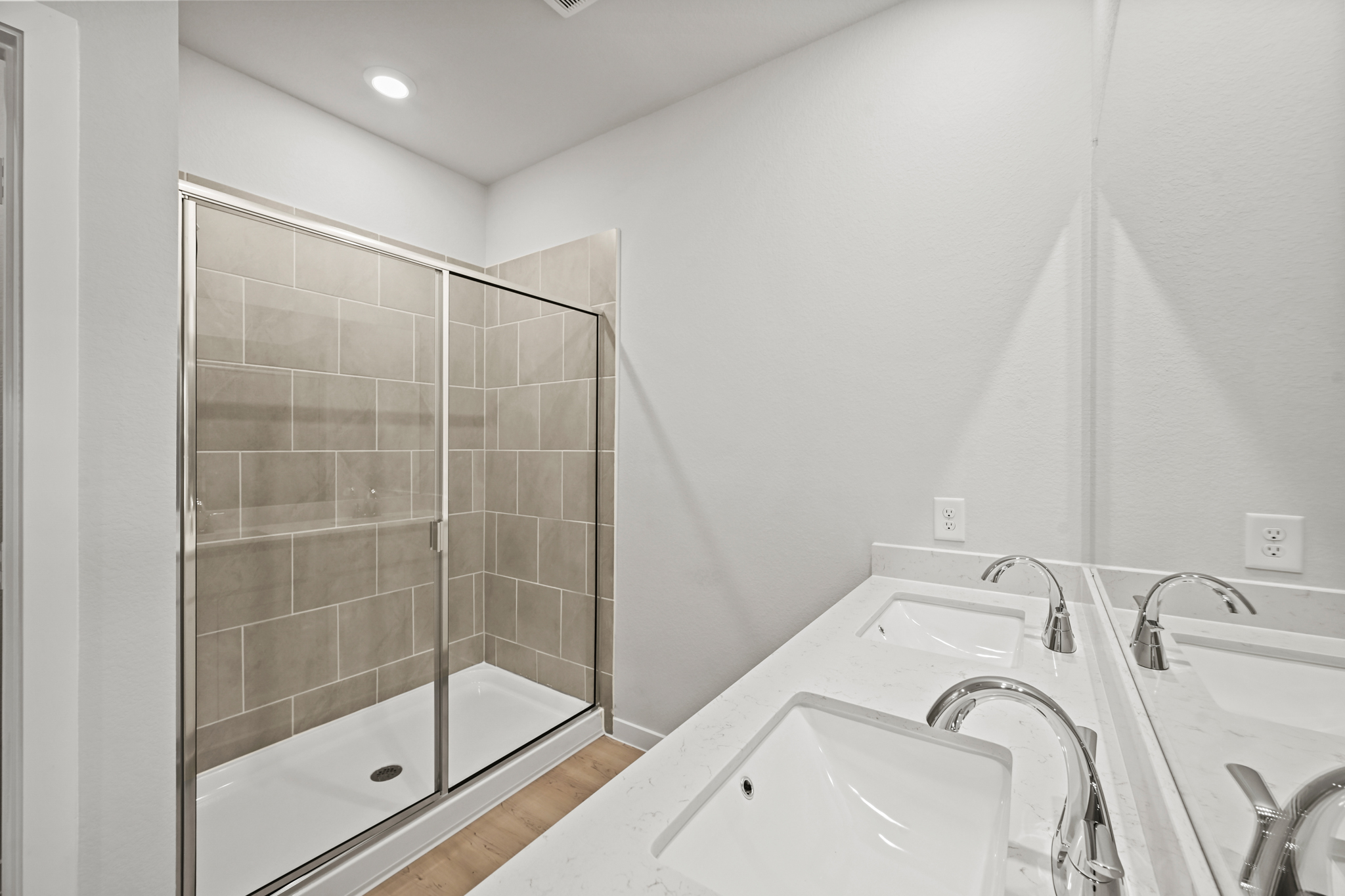 A bathroom with a glass shower.