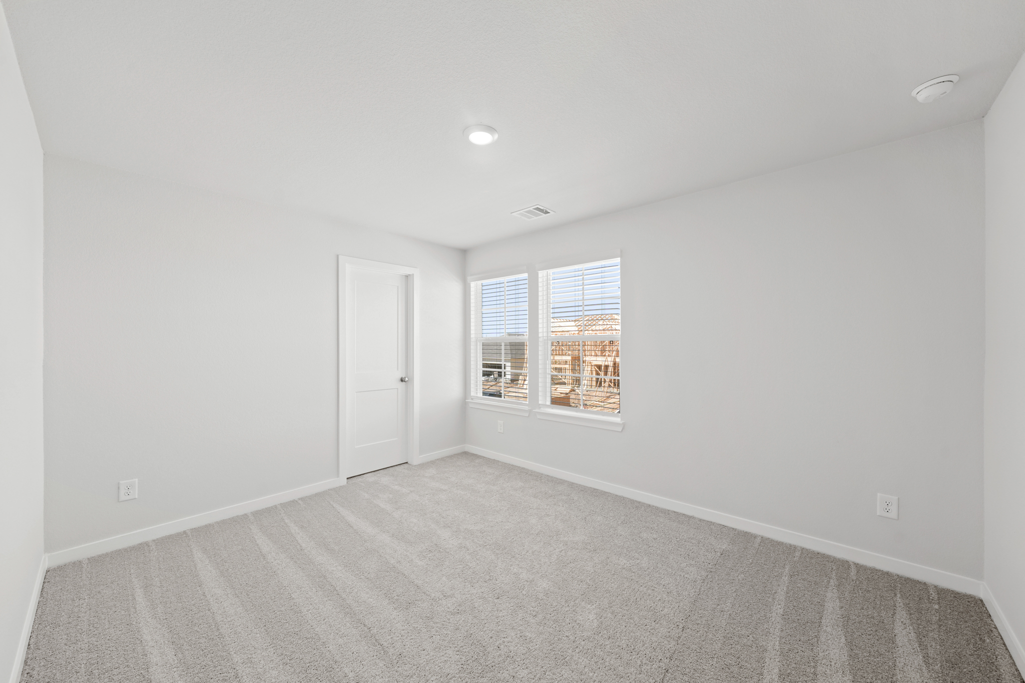 A room with a door and windows.