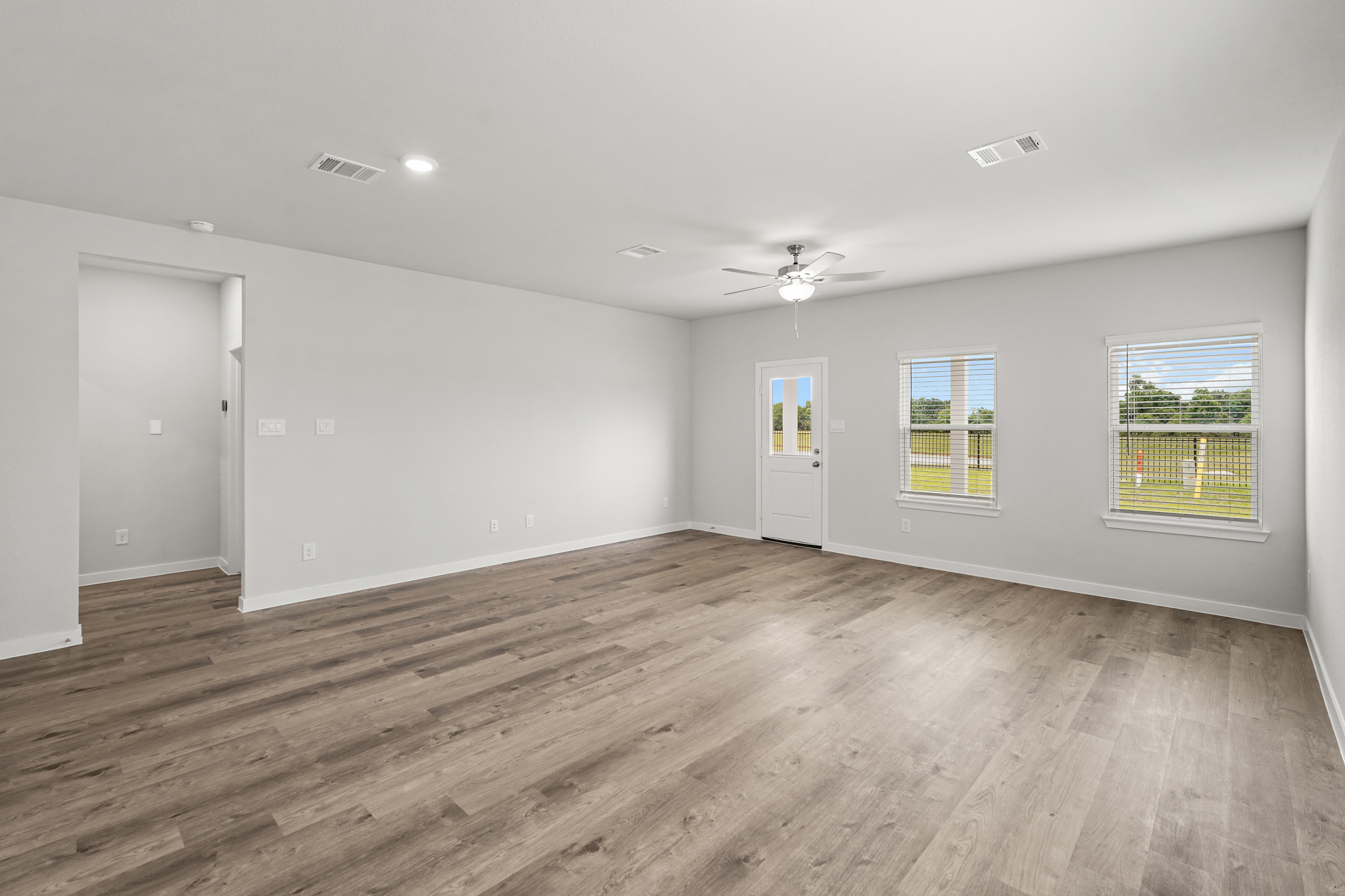 A room with a wood floor and a wood floor.