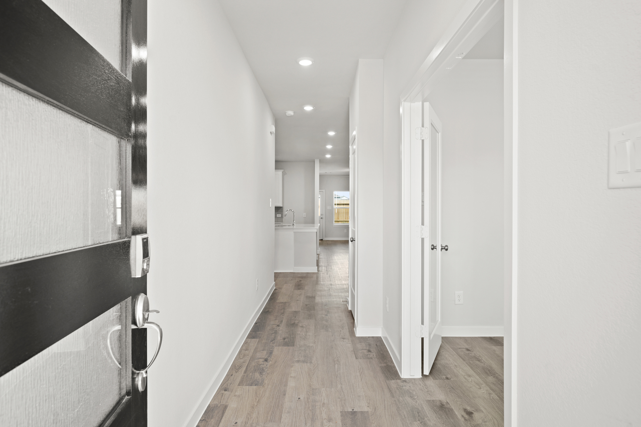 A hallway with white walls.