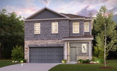A house with a garage and trees.