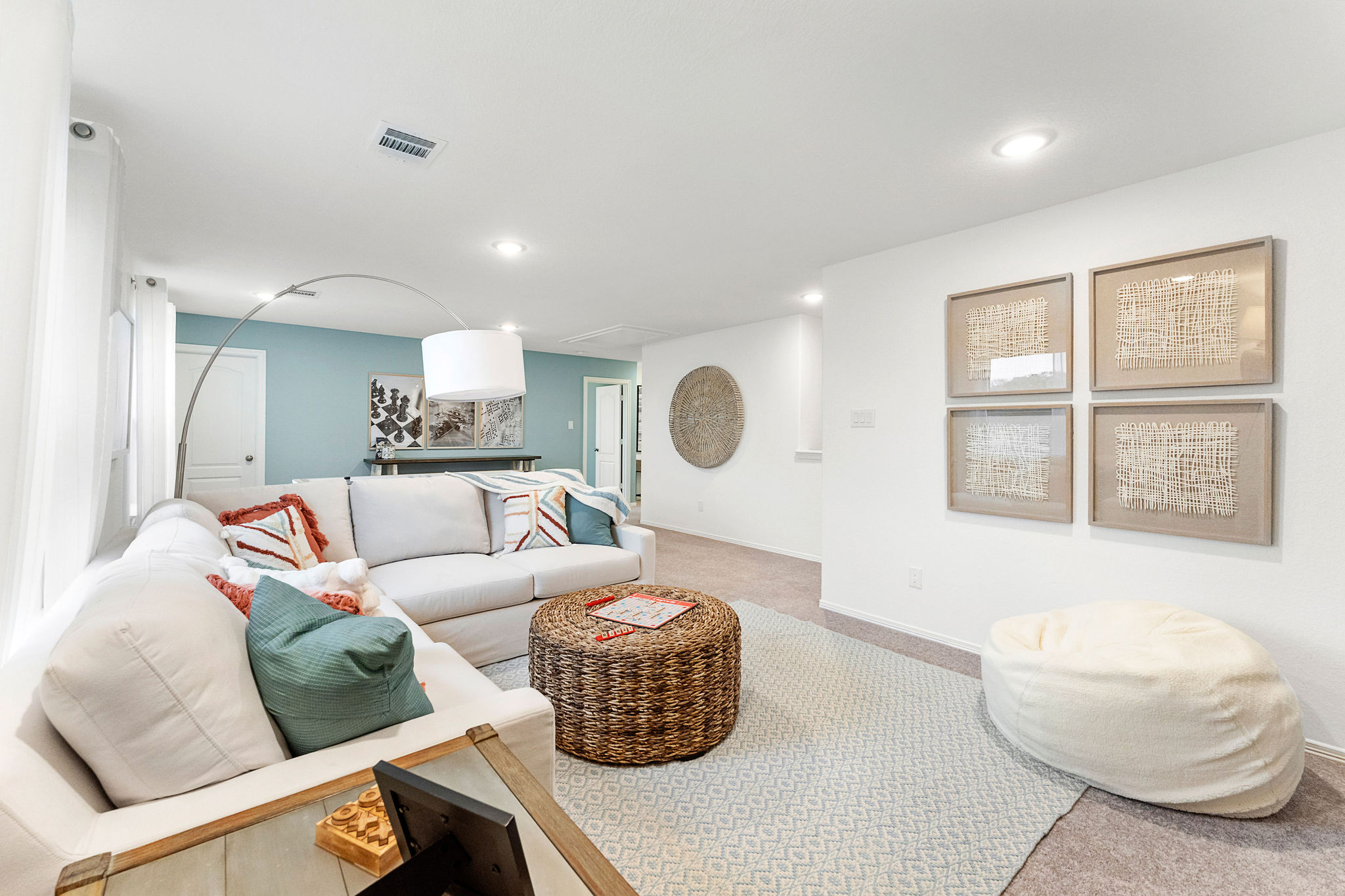 A living room with a couch and a table.
