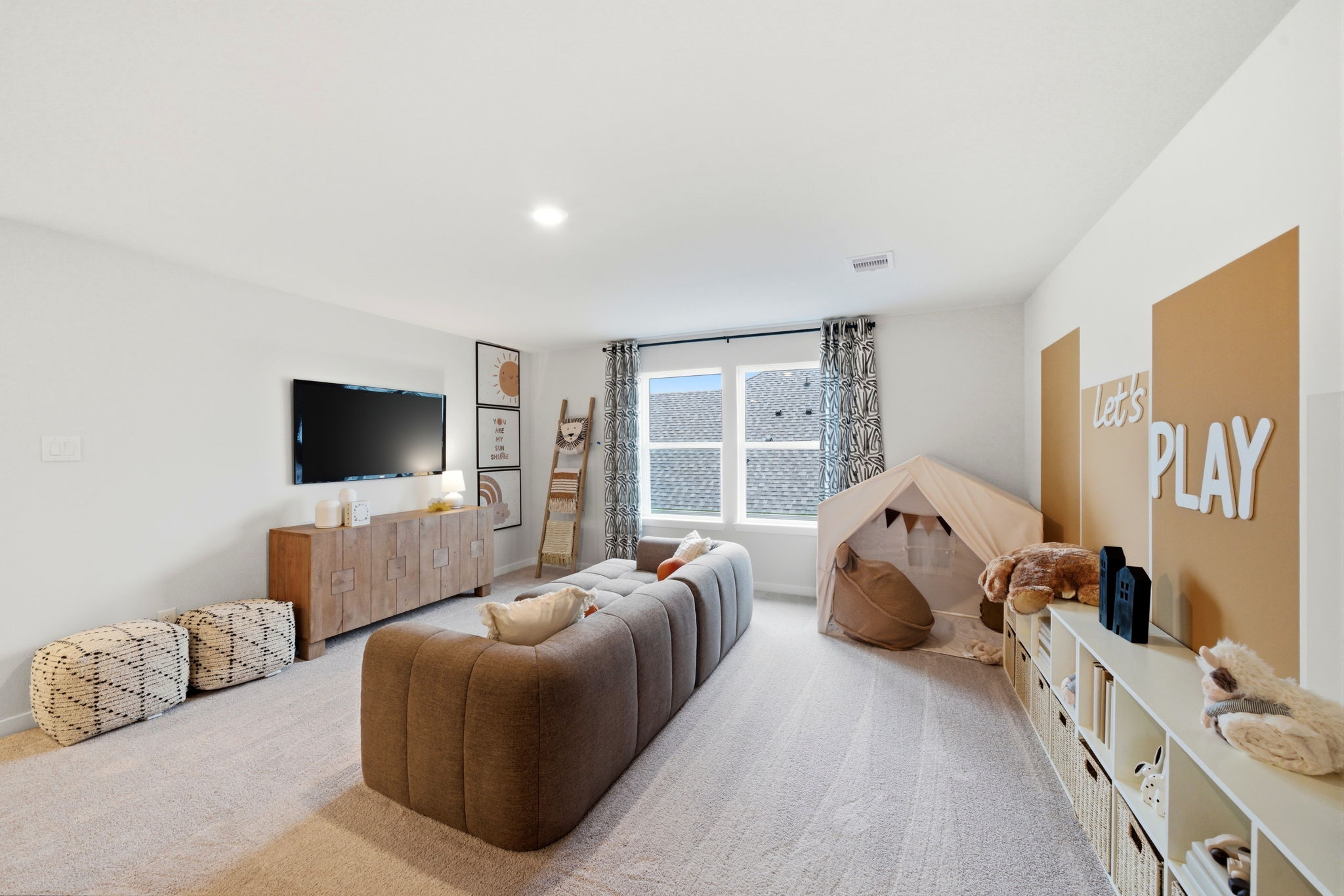 A living room with a tv and furniture.