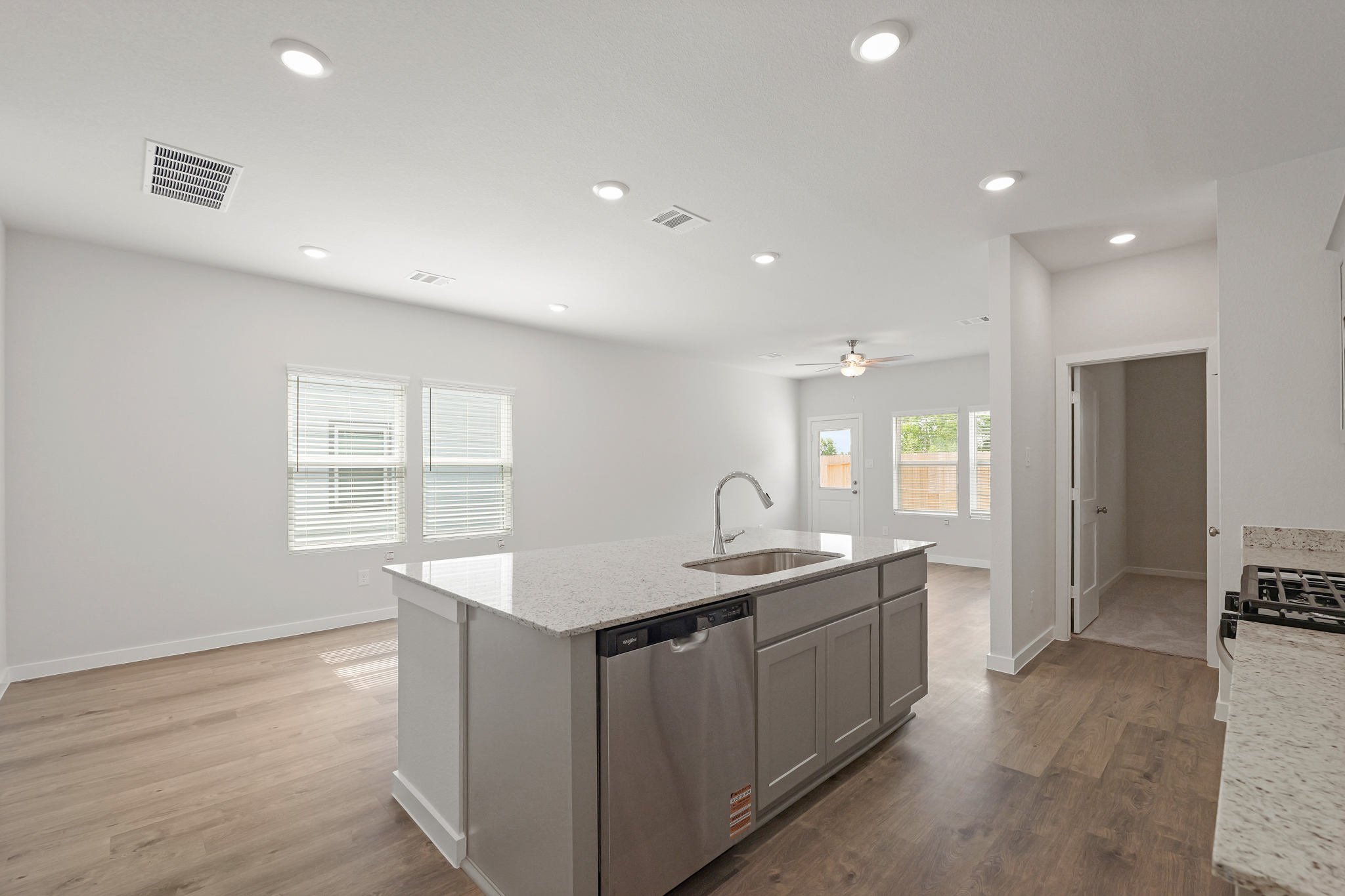 A kitchen with a sink and cabinets.