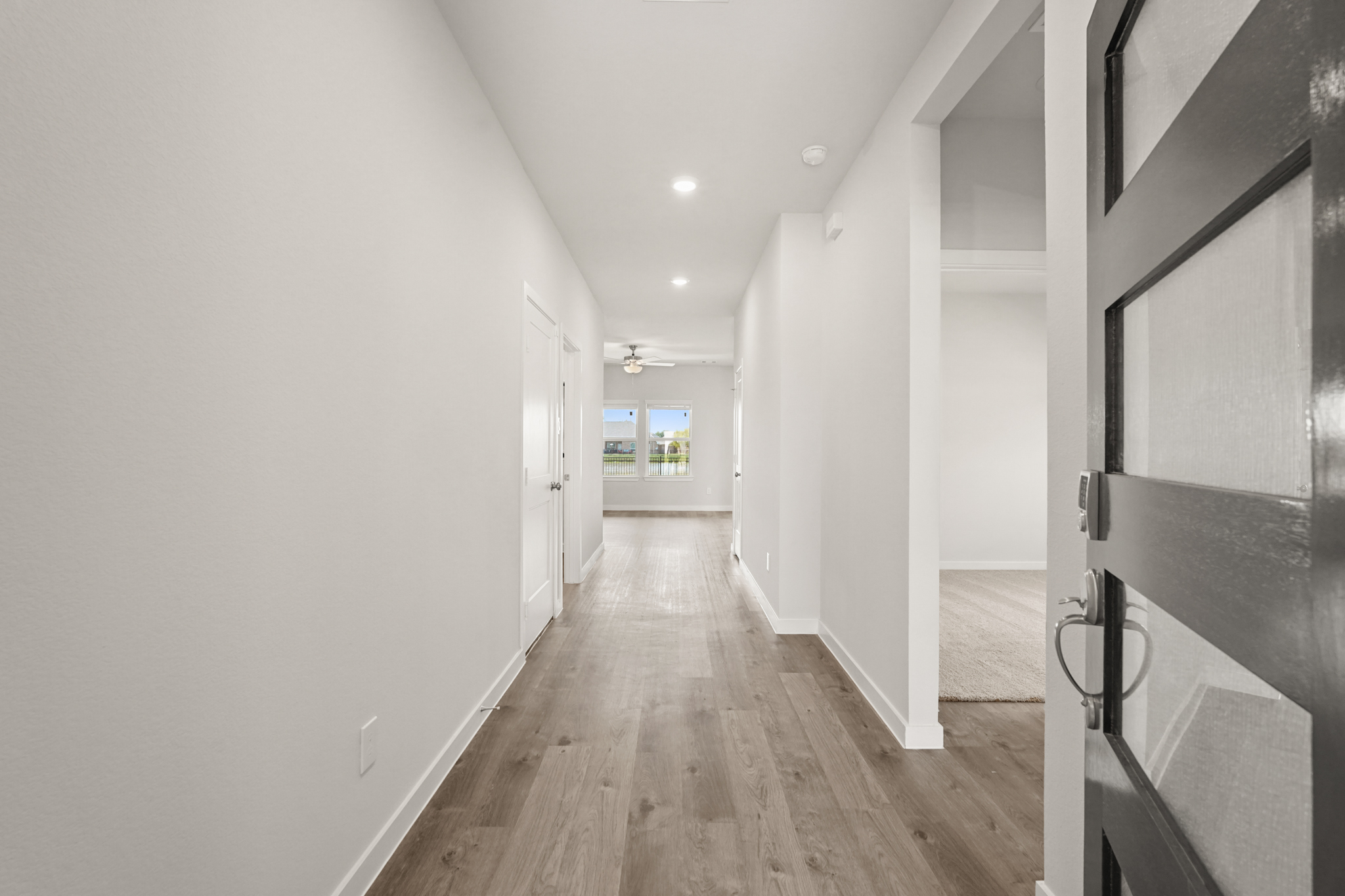 A hallway with white walls.
