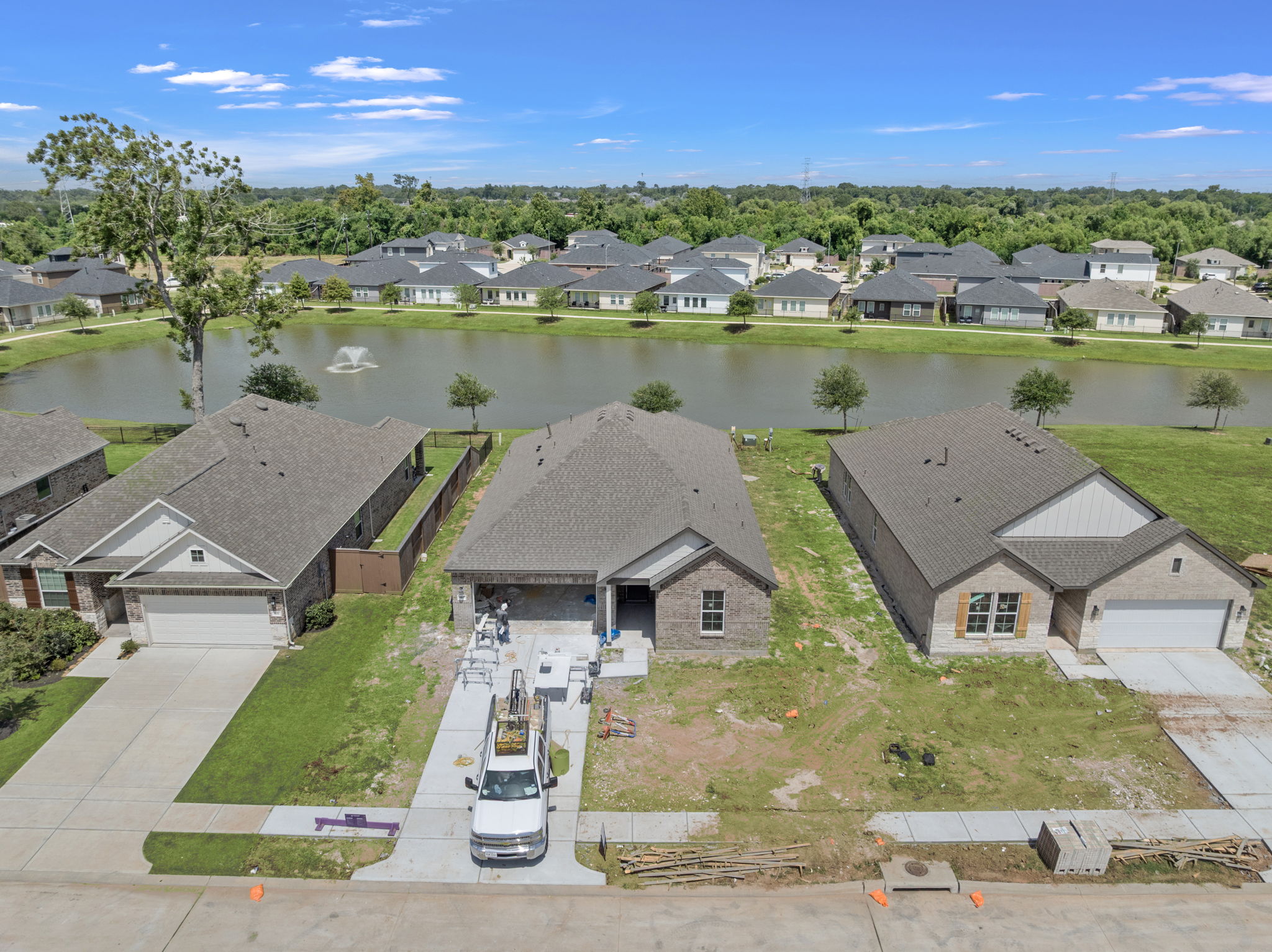 A group of houses next to a body of water.