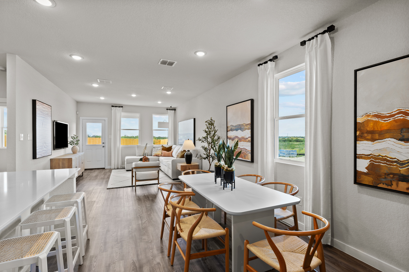 A large room with a table and chairs.