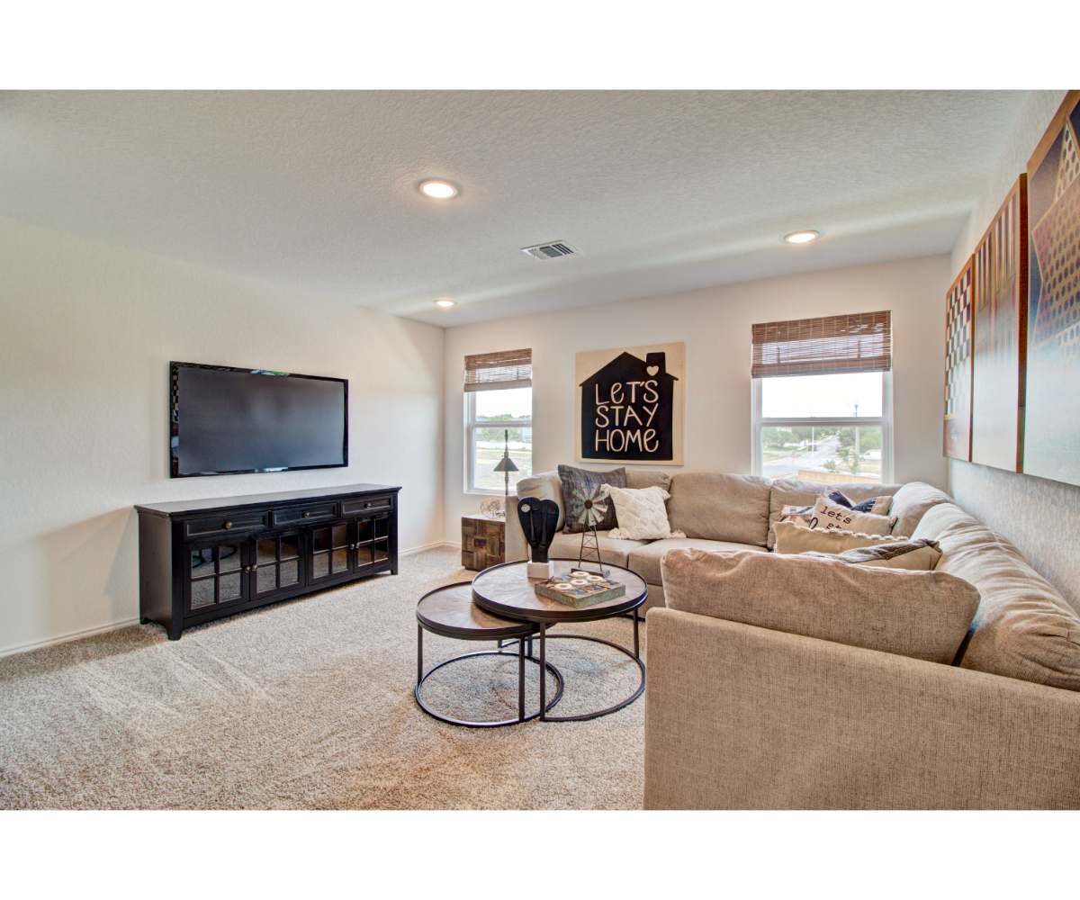 A living room with a tv and couches.
