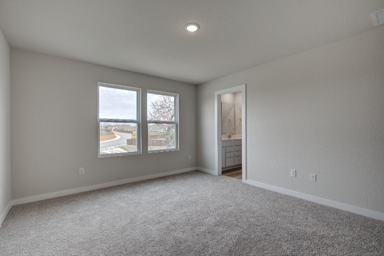 A room with a window and a door.