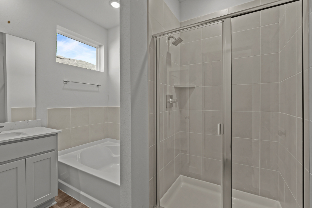 A bathroom with a glass shower.