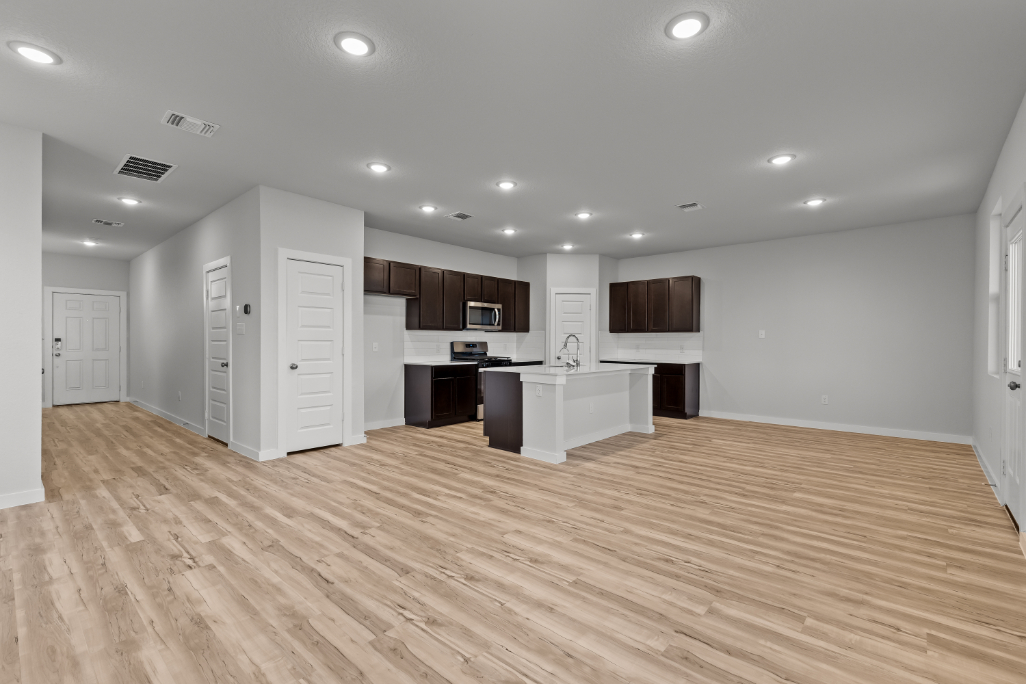 A large kitchen with white cabinets.