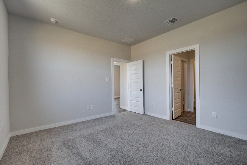 A hallway with white walls.