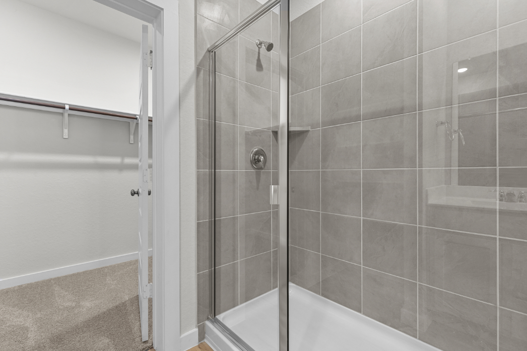 A shower with a glass door.