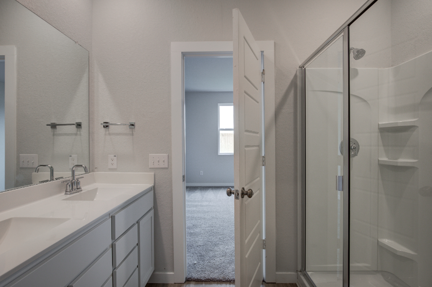 A bathroom with a glass shower.
