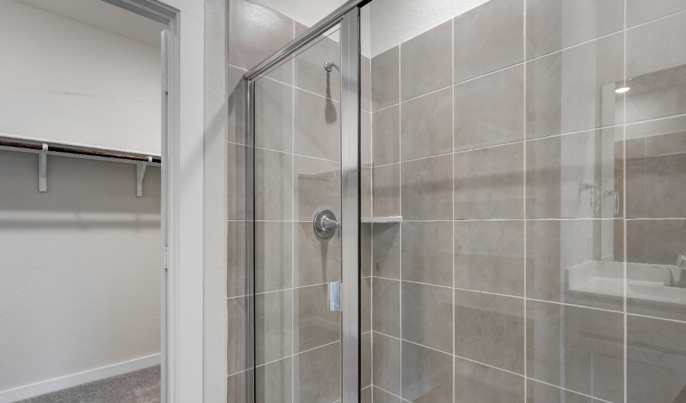 A shower with a glass door.