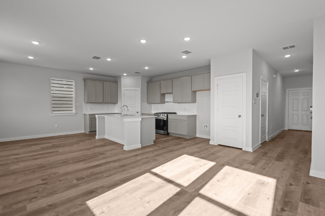 A large kitchen with white cabinets.