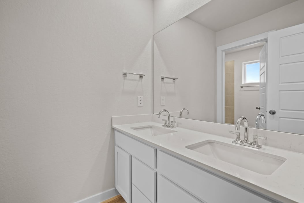 A bathroom with two sinks.