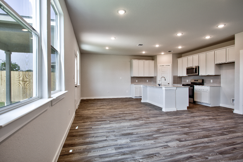 A kitchen with wooden floors.