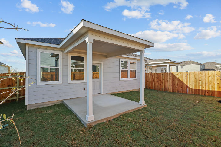 A small house with a small shed.