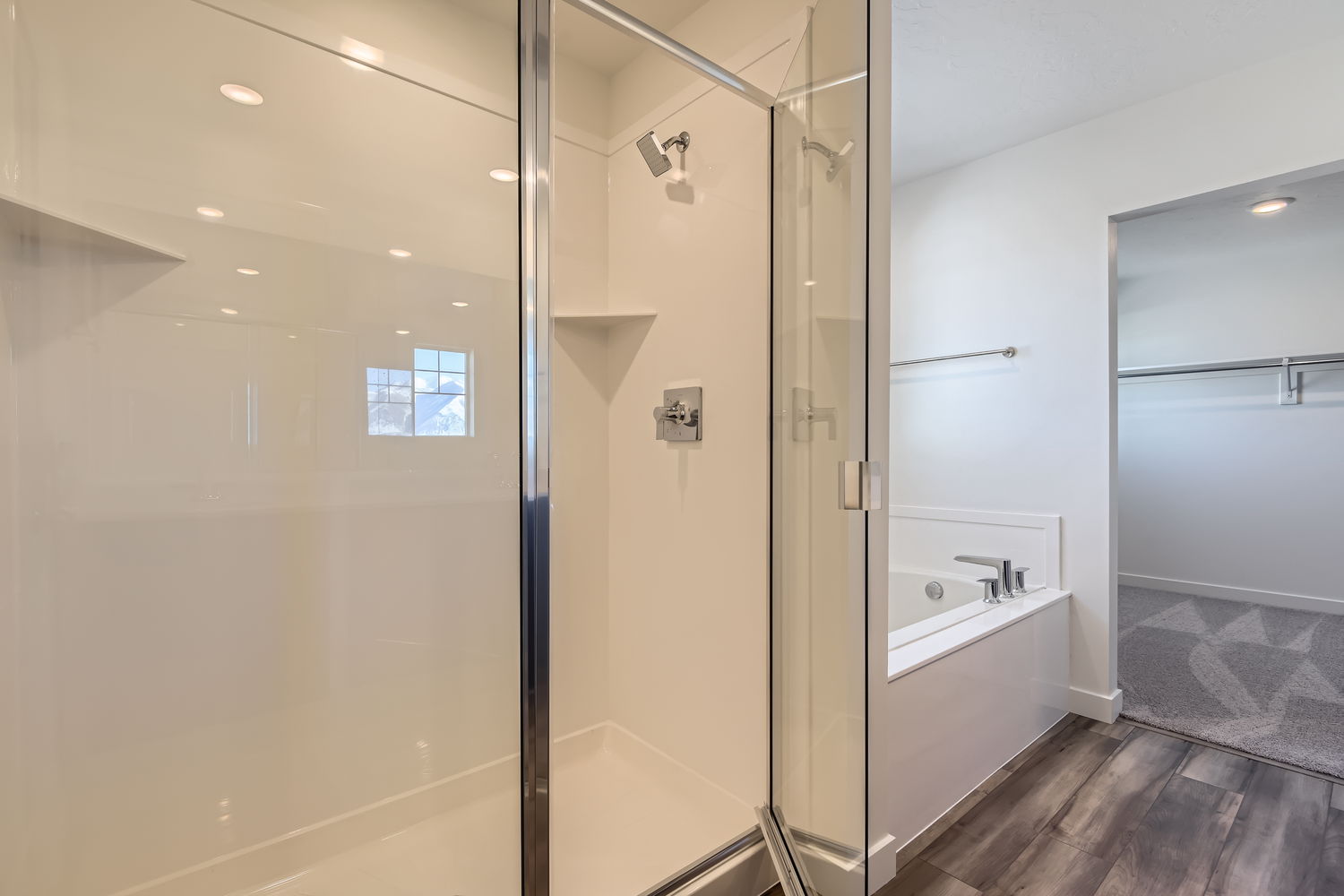A bathroom with a glass shower.