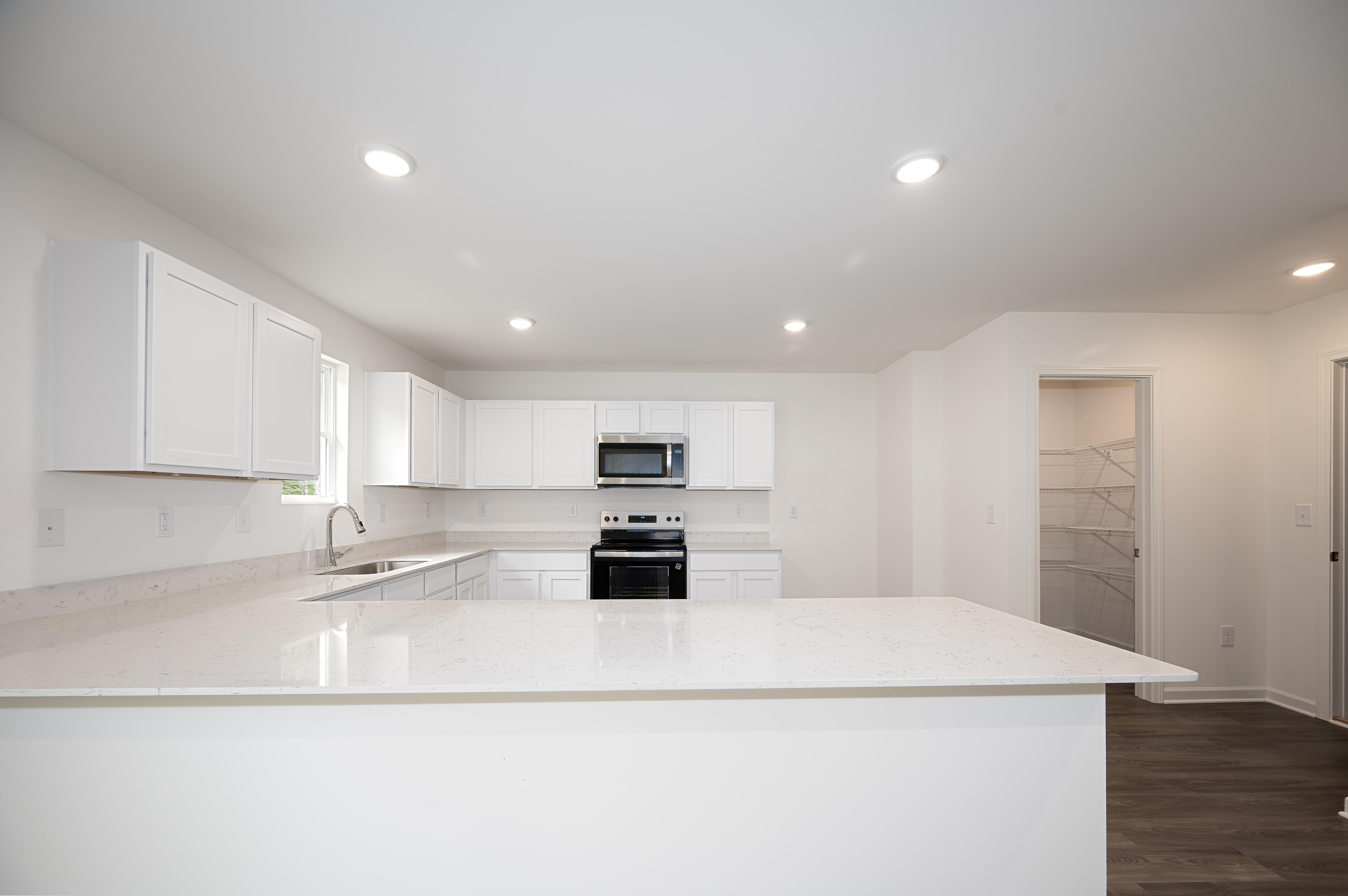 kitchen 1 - amberwood - unfurnished + quartz - se arrowhead by the lake