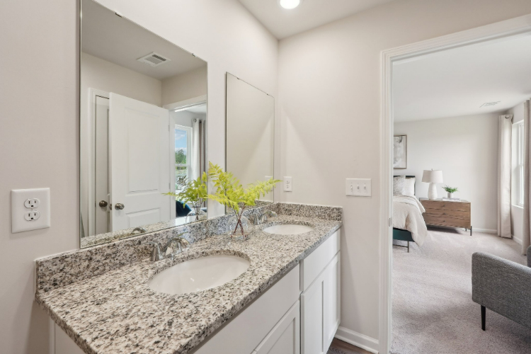 A bathroom with a marble countertop.