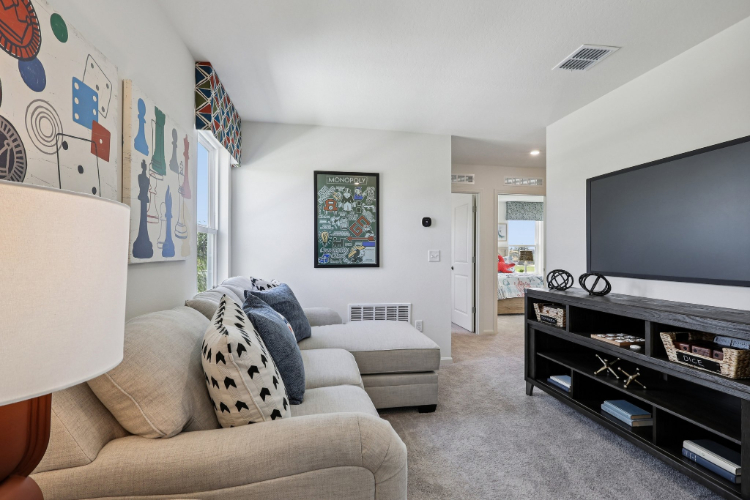 A living room with a tv and couches.