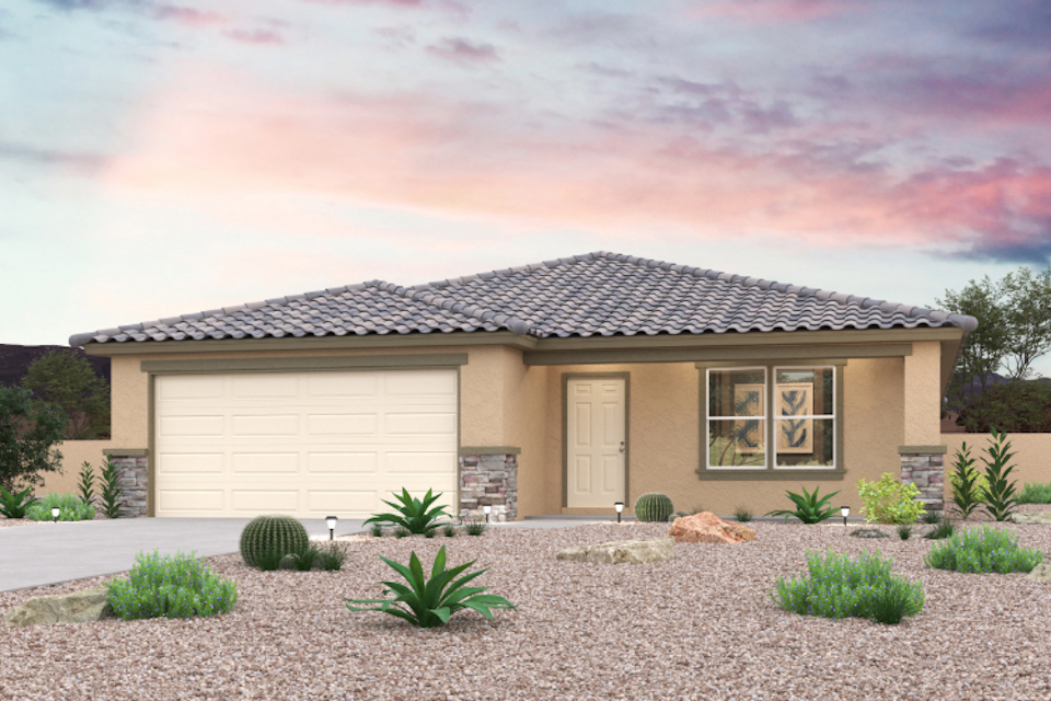 A house with a gravel driveway.