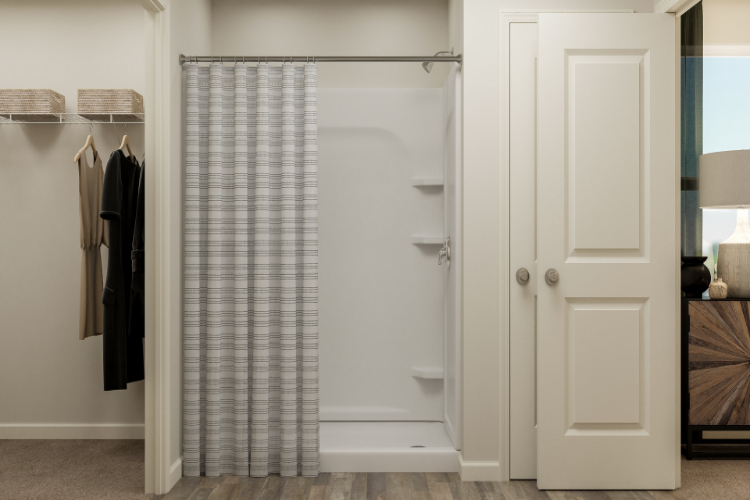 A shower with a glass door.