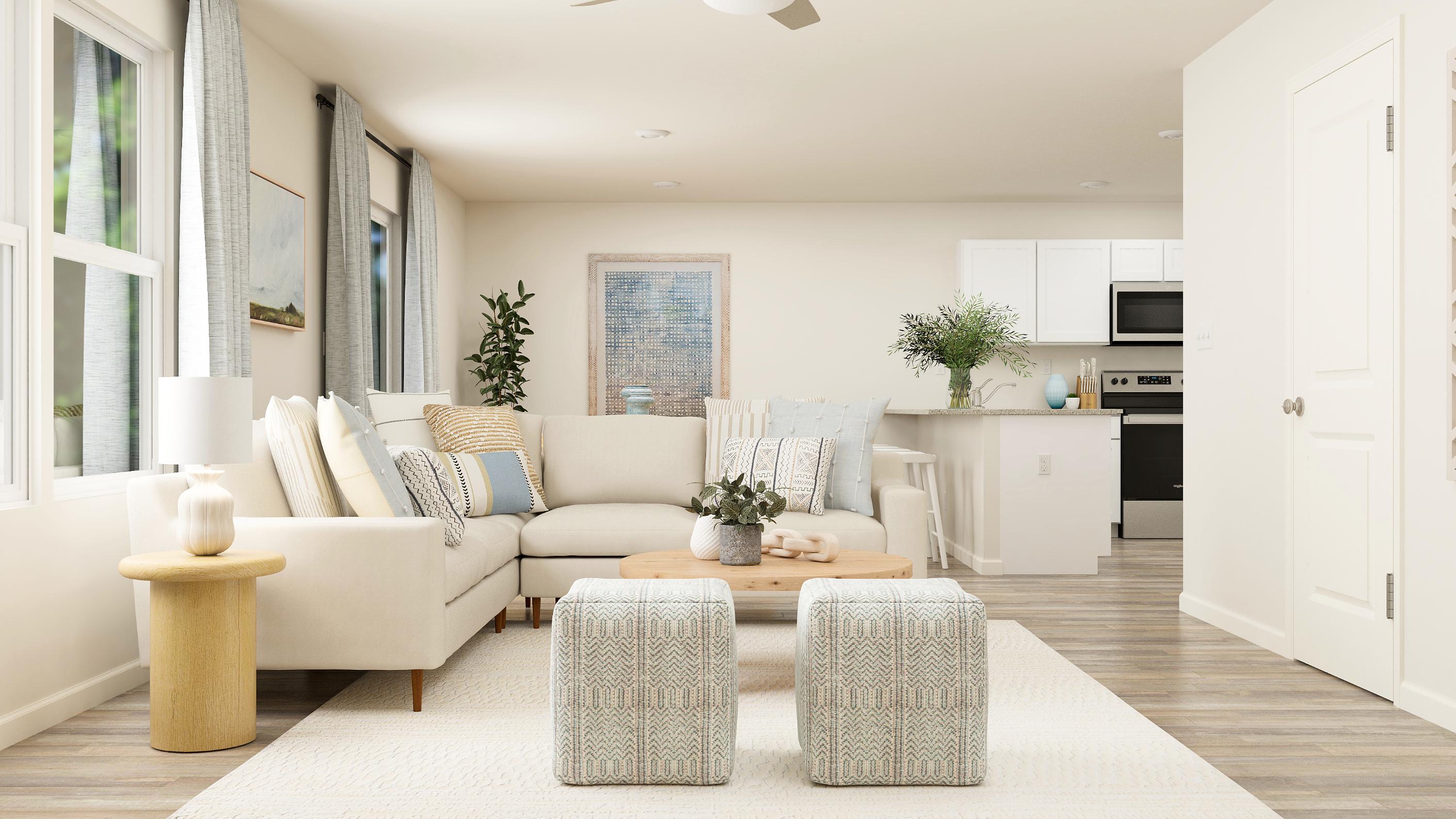 A living room with white furniture.