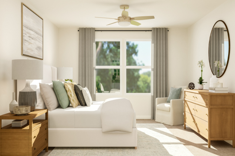 A living room with a white couch and a white chair.